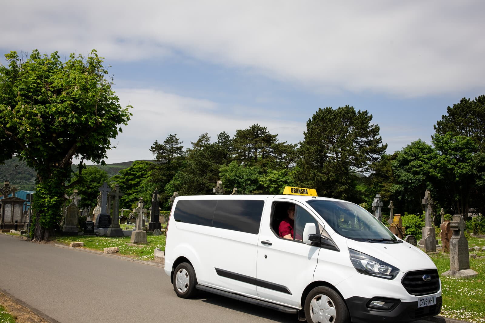 Gransha Taxis white van on road